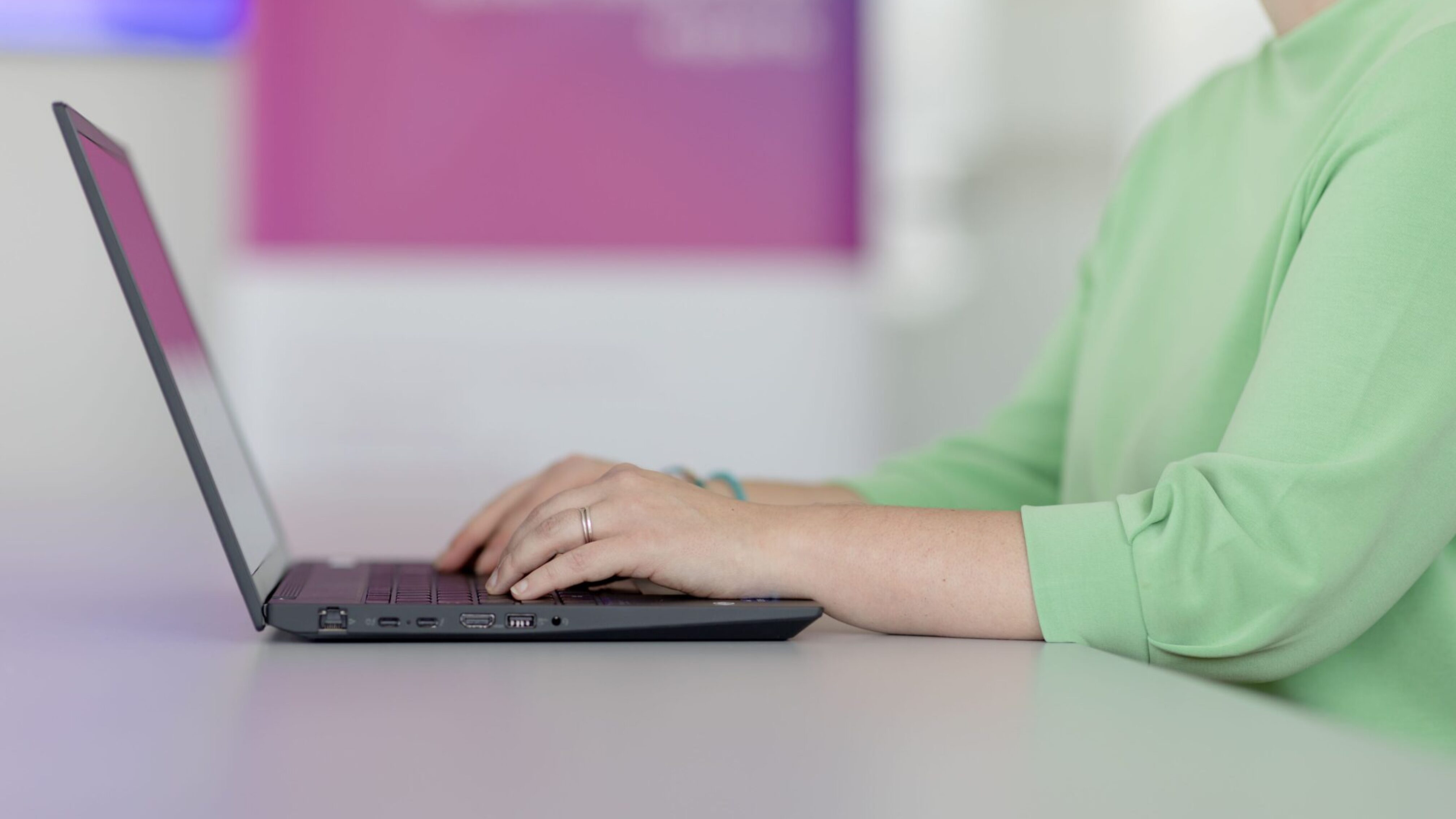 aurebus employee at her laptop.